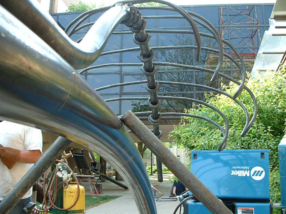 image of welder and light fixture under construction