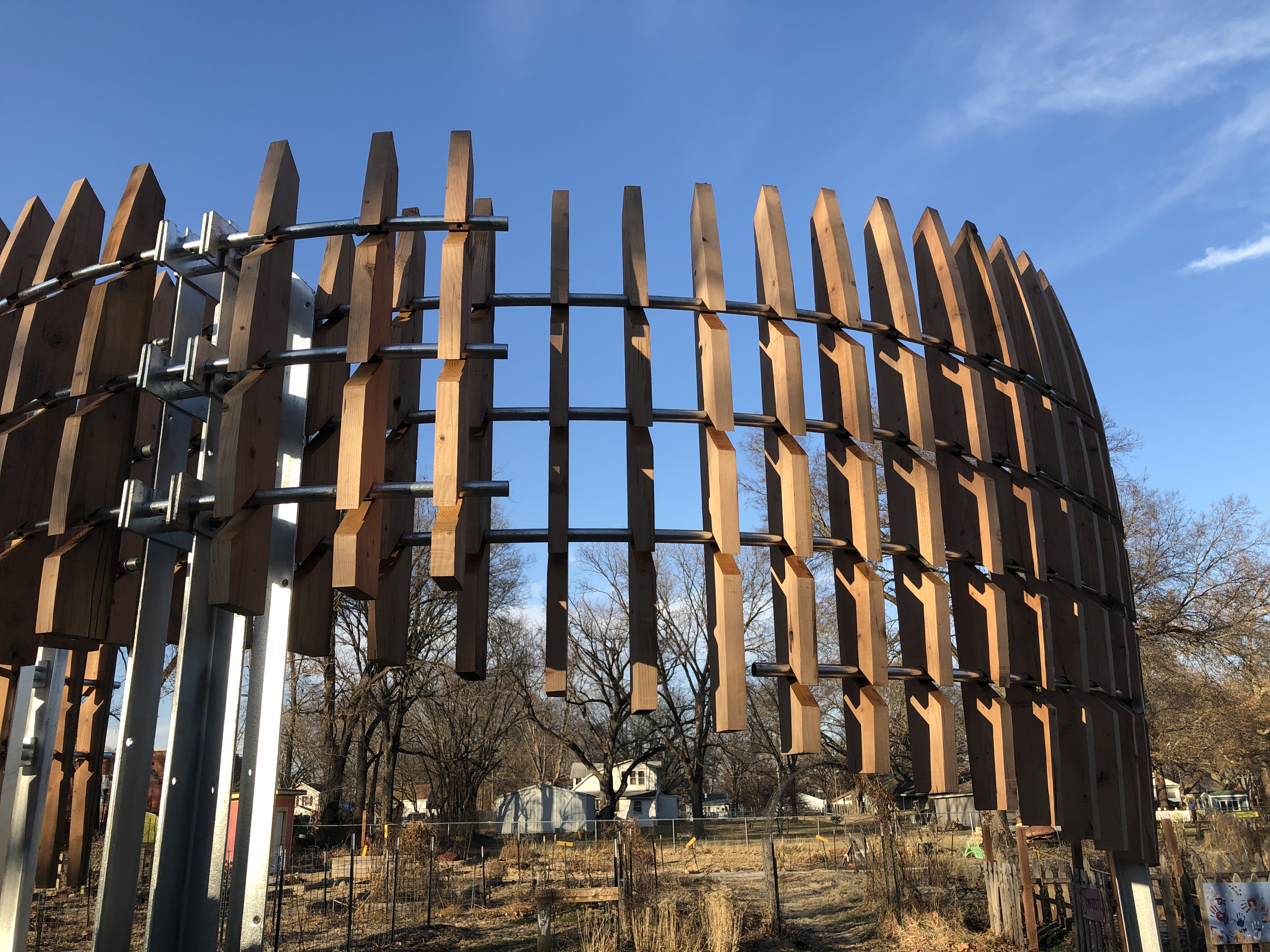 Repetitive wood fins hung on steel structure