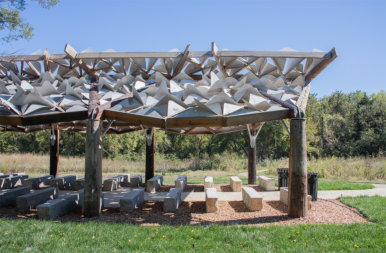 Architectural pavilion with trees behind it