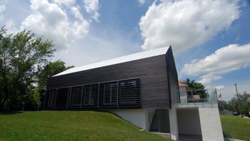 Modern house built into the side of a hill