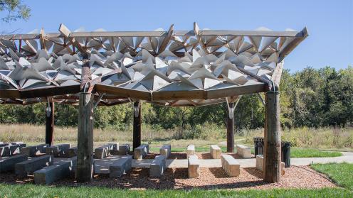 Architectural pavilion with trees behind it
